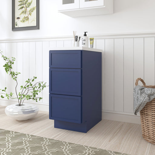 Navy blue shaker-style 3-drawer bathroom storage cabinet side angle view in white bathroom