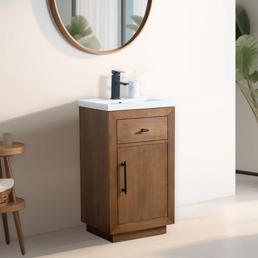 HomeBeyond 20-inch walnut bathroom vanity with closed door and drawer, round mirror and plant in warm-toned bathroom setting