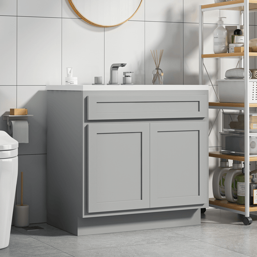 HomeBeyond 30-inch gray bathroom vanity cabinet with white sink top, left angled view in modern bathroom