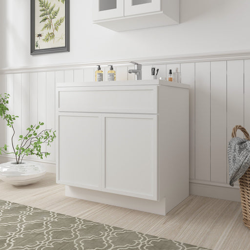 White 33-inch freestanding bathroom vanity base cabinet with two doors and drawer, angled room setting with white sink top