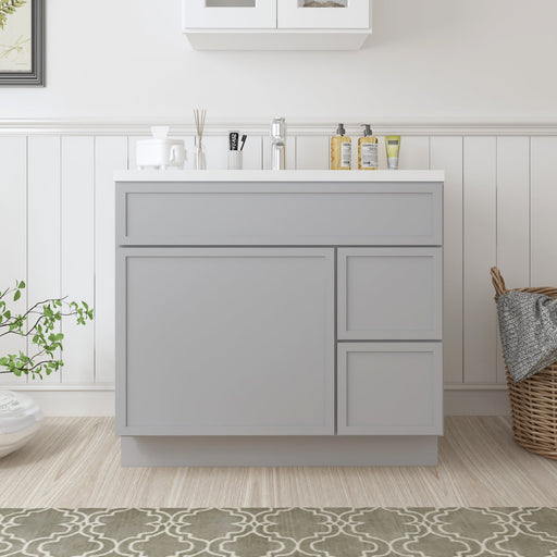 36-inch light gray bathroom vanity cabinet with white sink top, front view in styled bathroom setting