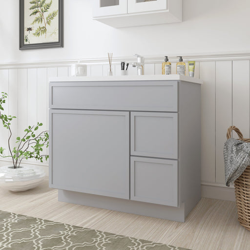 36-inch light gray bathroom vanity cabinet with white countertop, angled view in bright bathroom