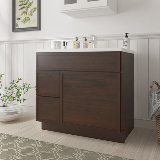 36-inch dark brown wood bathroom vanity cabinet with left drawers, angled view in bathroom