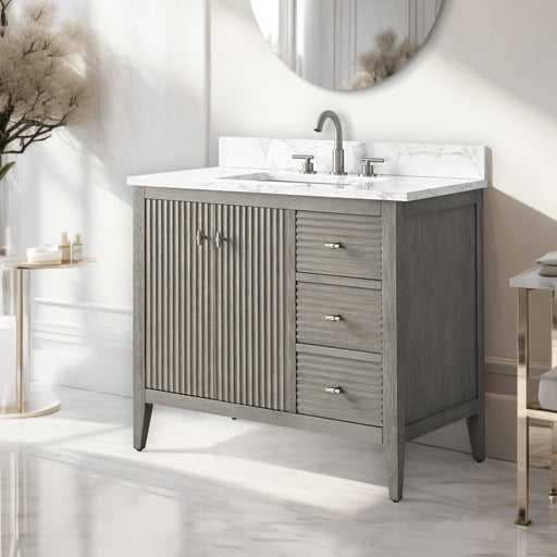 36-inch gray oak bathroom vanity with chrome hardware and white marble top, angled side view in neutral room
