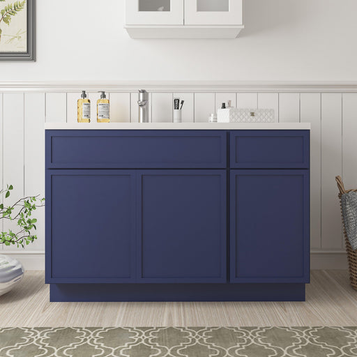 48-inch navy blue bathroom vanity cabinet with white sink countertop, front view in bathroom