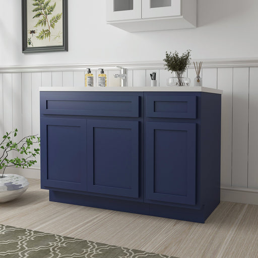 54 inch navy blue bathroom vanity cabinet angled view with white countertop and chrome fixtures