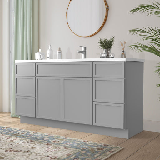 66-inch light gray bathroom vanity cabinet angled view in bright bathroom with white countertop and round mirror