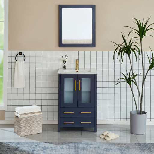 Brescia 24-inch navy blue bathroom vanity with gold faucet and hardware in white tiled bathroom, front room setting