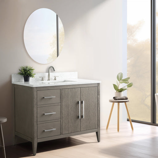 42-inch single sink bathroom vanity in gray oak finish with brushed nickel hardware, marble top, left drawers, natural light
