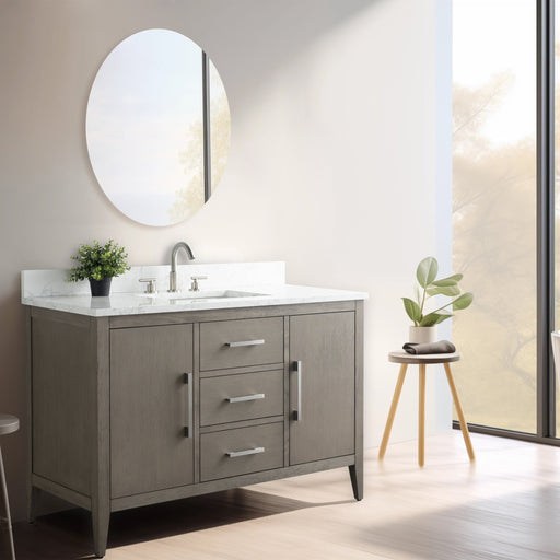 48 inch gray-brown bathroom vanity with white marble countertop, undermount sink, round mirror, large window