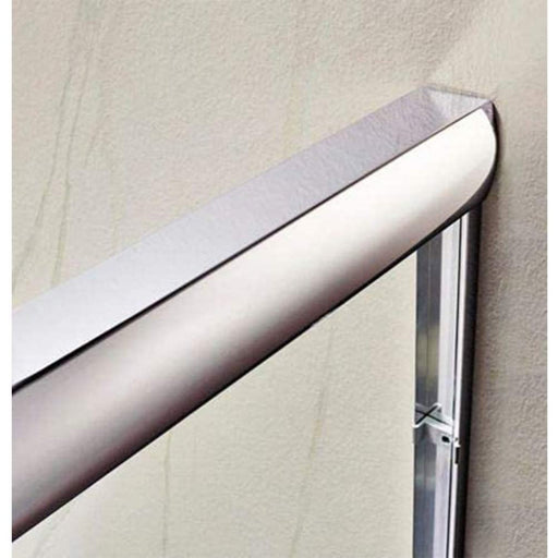 Close-up of polished chrome top rail corner detail on frameless sliding shower door