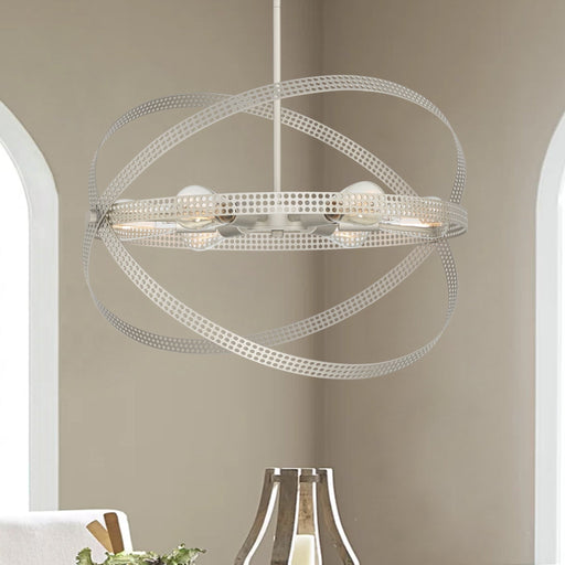 Antique silver 6-light globe chandelier with perforated metal orbital bands in dining room setting